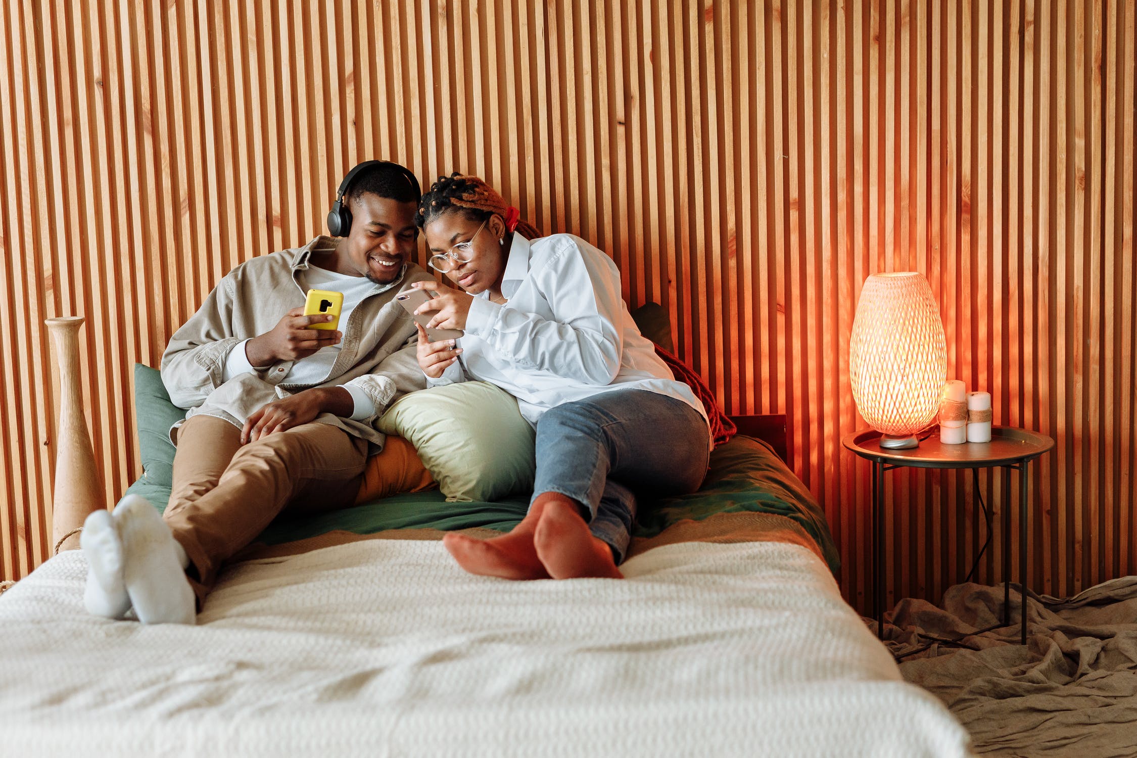 Black couple resting in bedroom