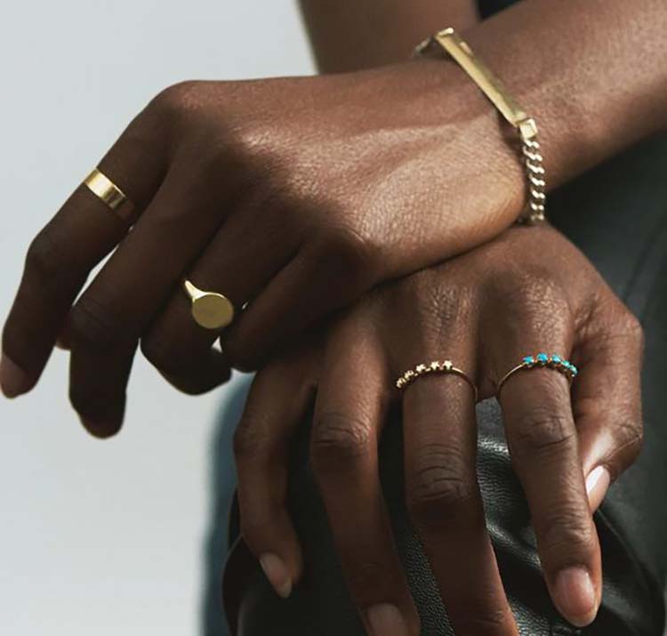 black woman wearing jewelry rings