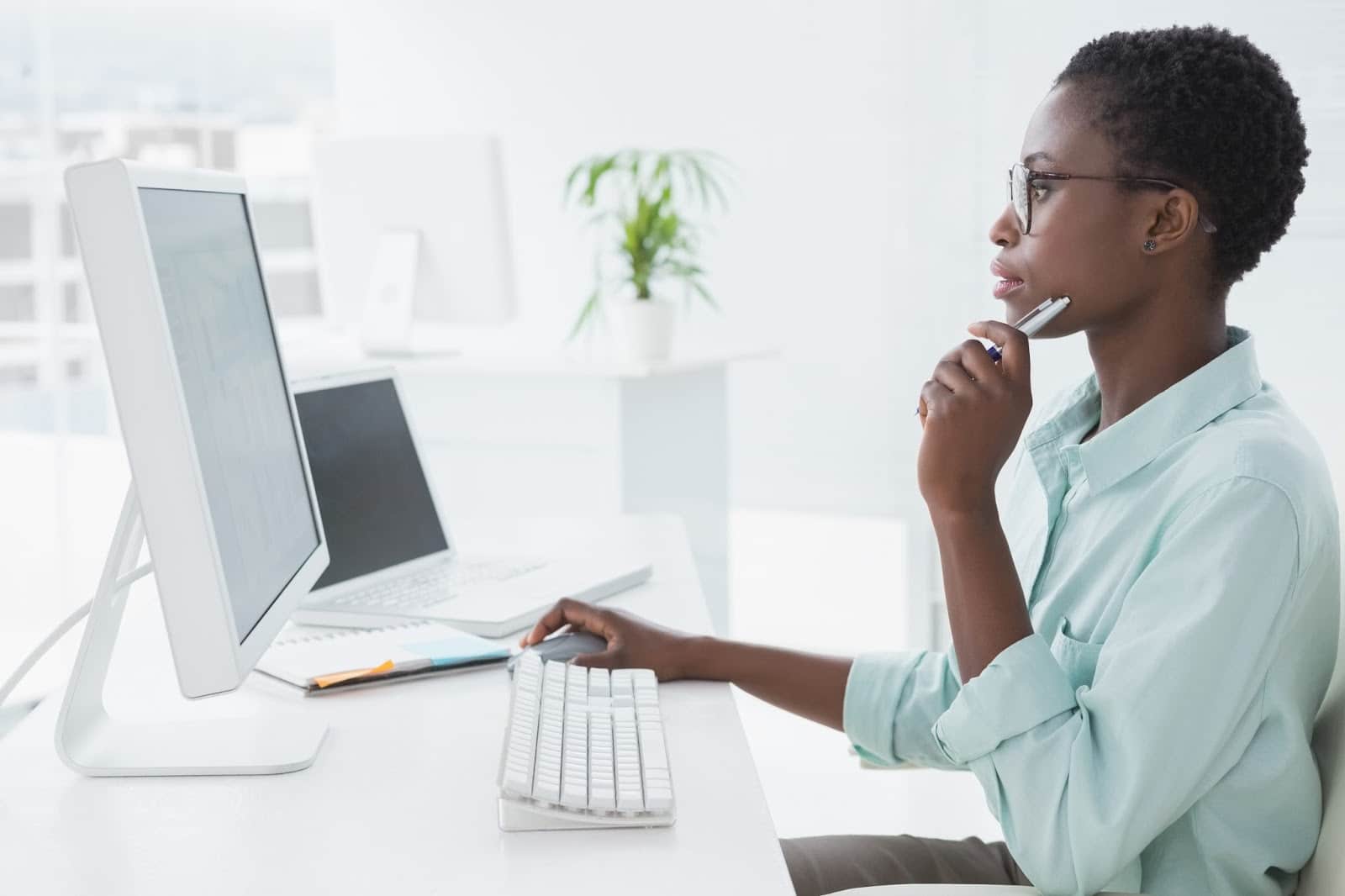 Black woman looking at computer