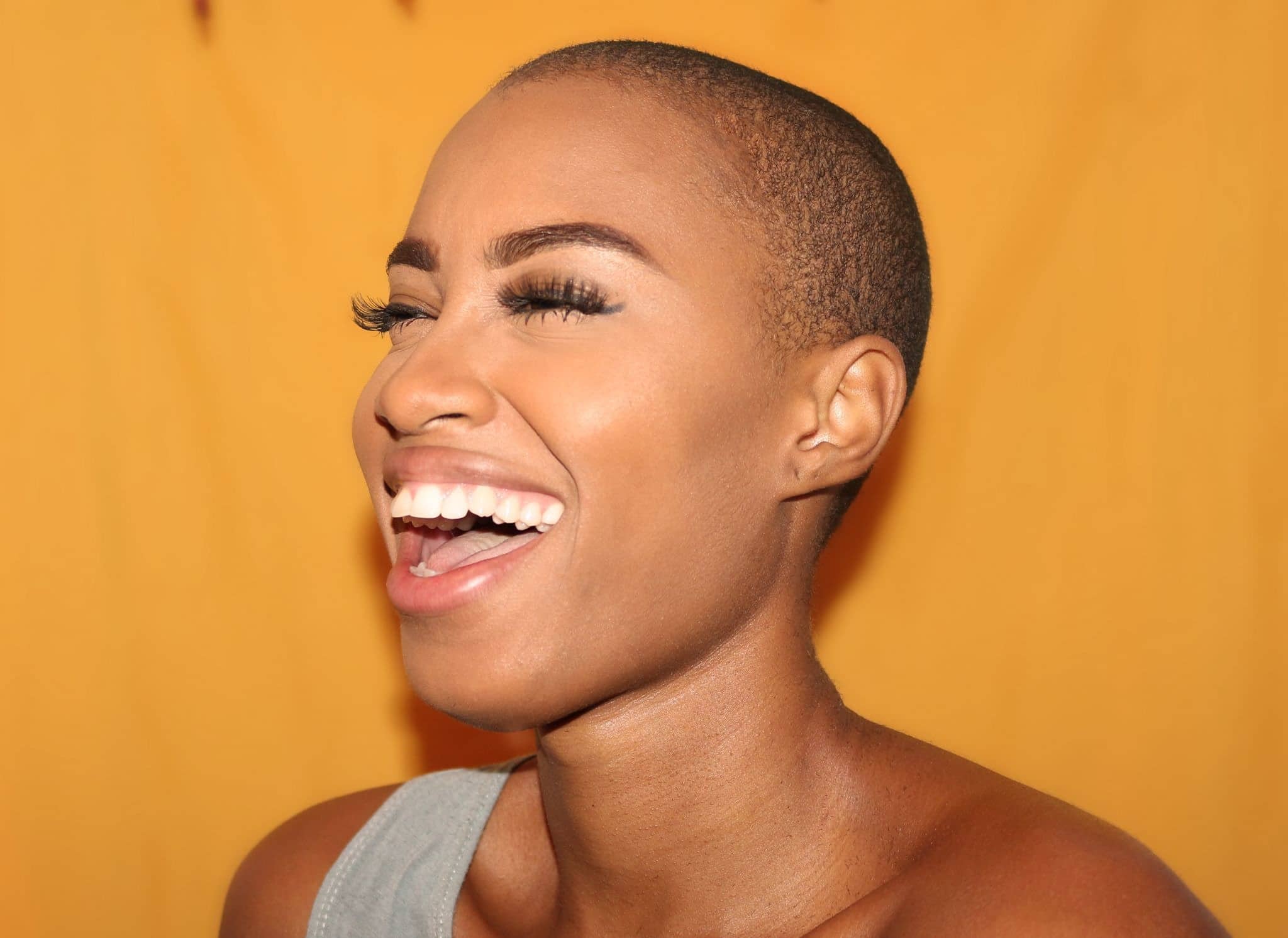 black woman smiling and laughing